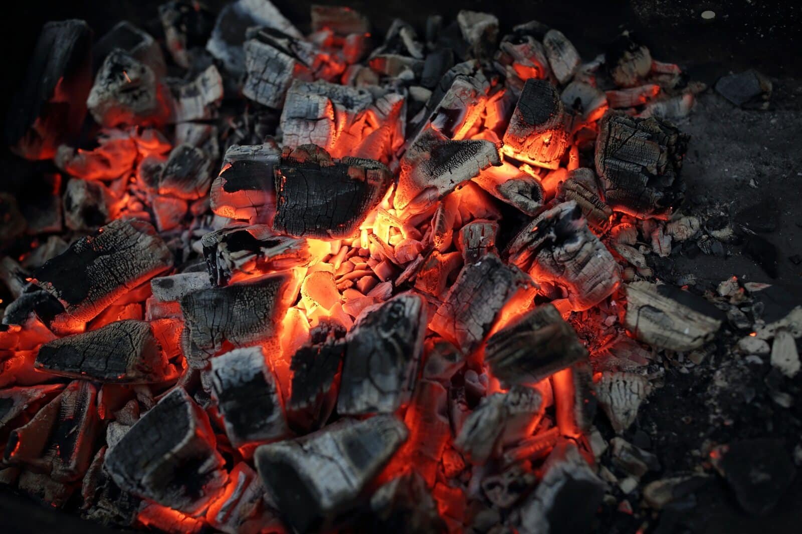 Glowing biochar and charcoal embers